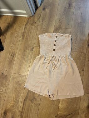 Strapless Smocked Button-Front Romper in beige. Size Large
